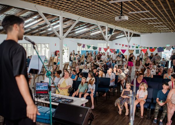 view from stage our to an audience sitting in a hall