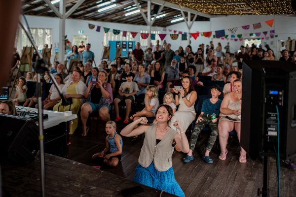view from stage of audience and choir teacher